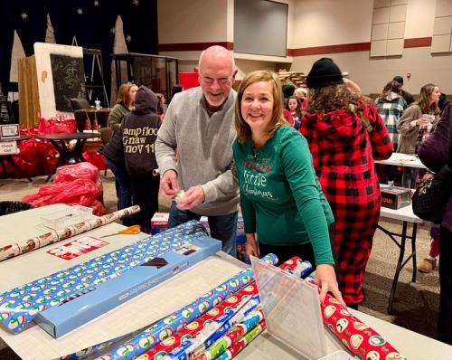 Secret-Families-Volunteers-wrapping-presents-2