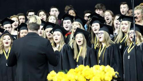 John Neubauer and NHS Choir members